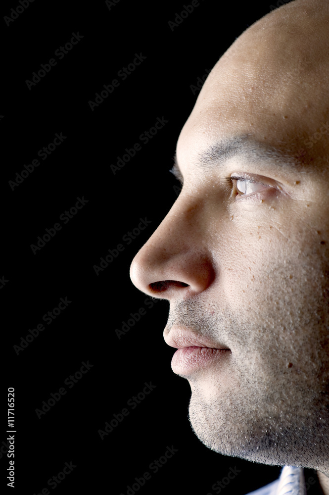 Man Portrait on Black closeup Man Portrait on Black closeup