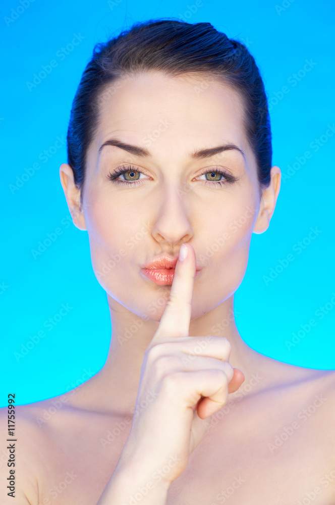 Portrait of 20-25 years old beautiful woman on blue background Portrait of 20-25 years old beautiful woman on blue background