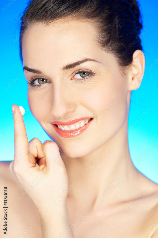 Portrait of 20-25 years old beautiful woman with cream Portrait of 20-25 years old beautiful woman with cream