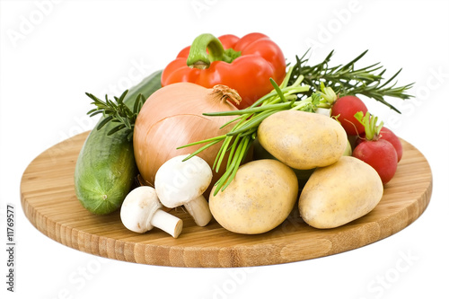 vegetables arranged on a wooden board