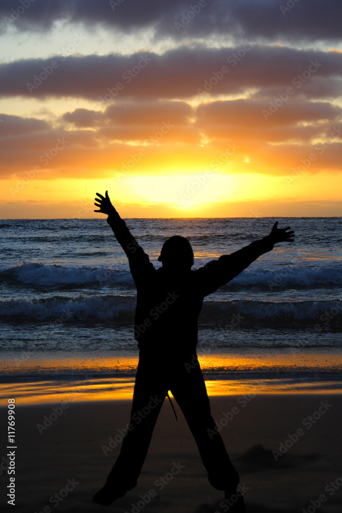 Fototapeta premium Person arms stretched with sunset