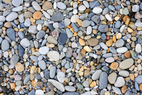 A variety of smooth stones on beach