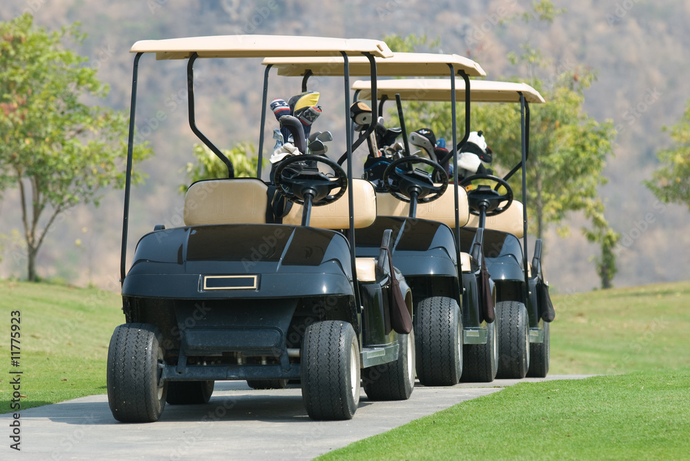 Three golf cars