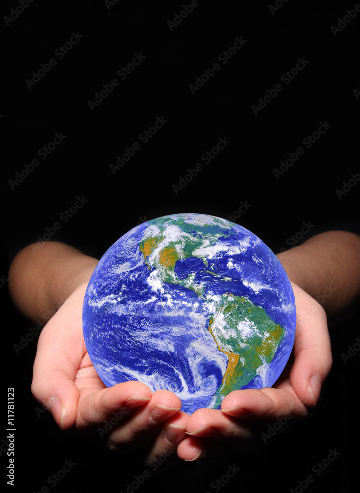 earth in woman's hands on black background earth in woman's hands on black background