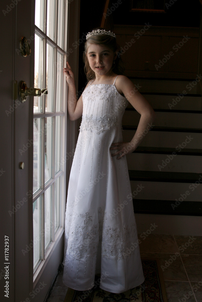 Fototapeta premium pretty young girl in white bridesmaid's dress and tiarra