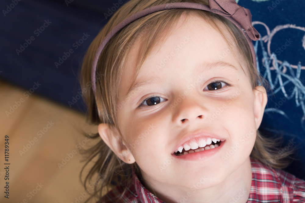 Portrait of a joyful little girl with sketched blackboard Portrait of a joyful little girl with sketched blackboard