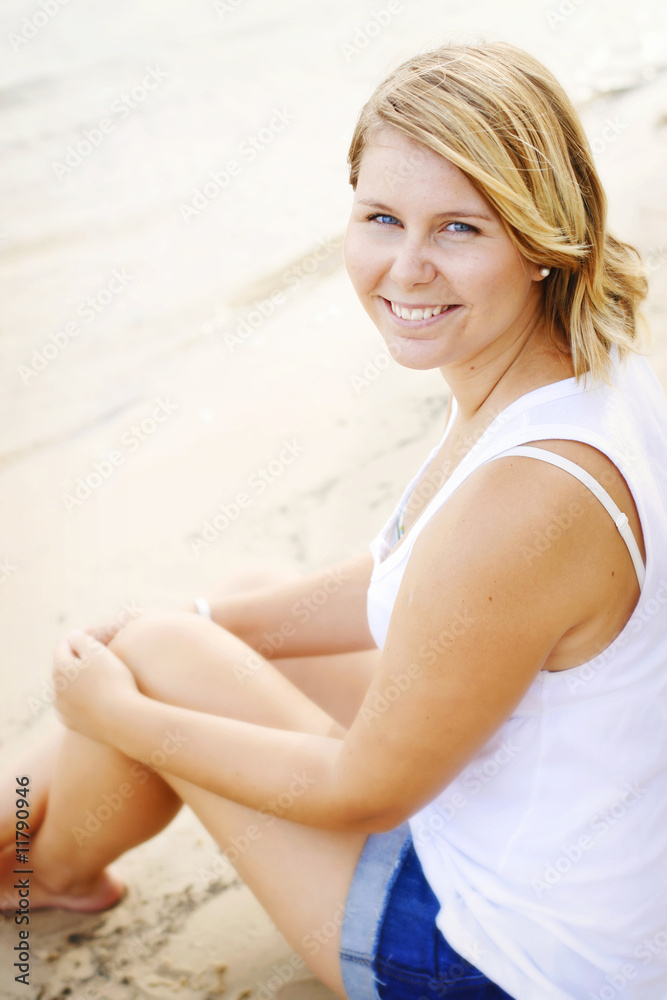 Beautiful young caucasian woman at the beach