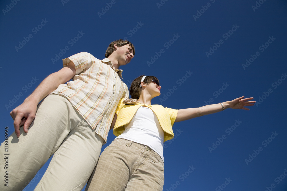 Young couple looking into bright future Young couple looking into bright future