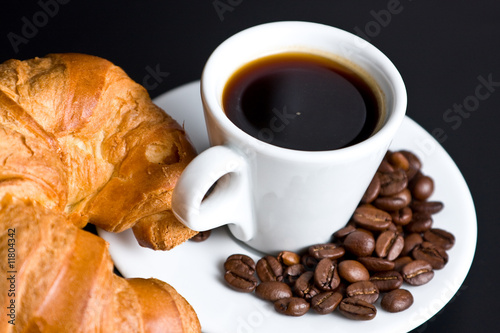Cup of coffee and croissant