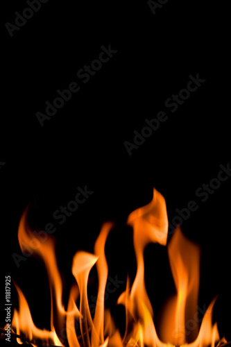 flame isolated over black background © Olga Miltsova