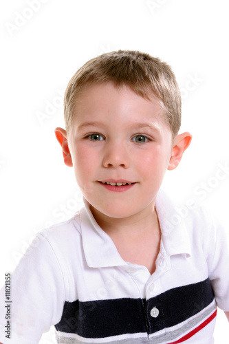 head and shoulders portrait of cute boy smiling