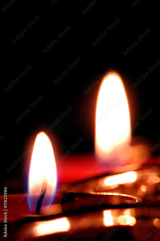 romantic candle flames against black romantic candle flames against black