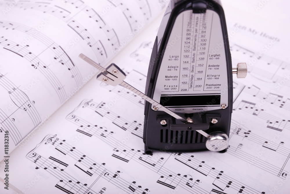 Fototapeta premium metronome on the sheet music