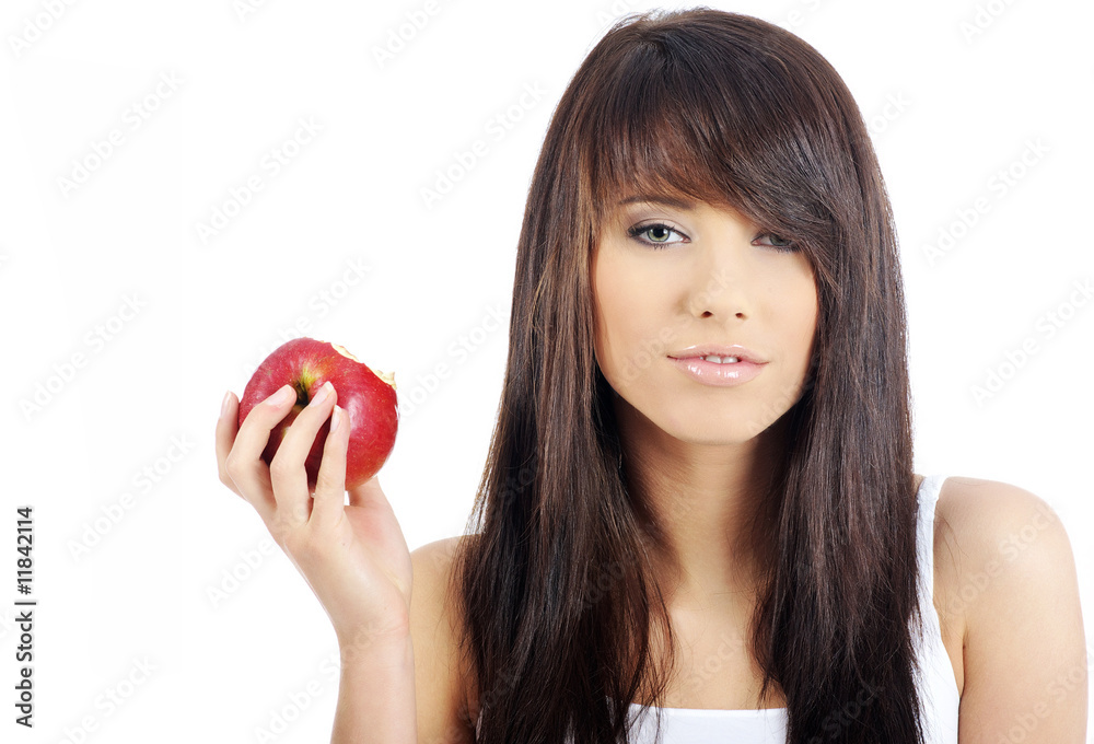 Beautiful young woman eating red apple. Isolated over white Beautiful young woman eating red apple. Isolated over white