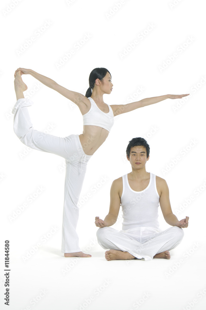 Couple doing yoga exercises together