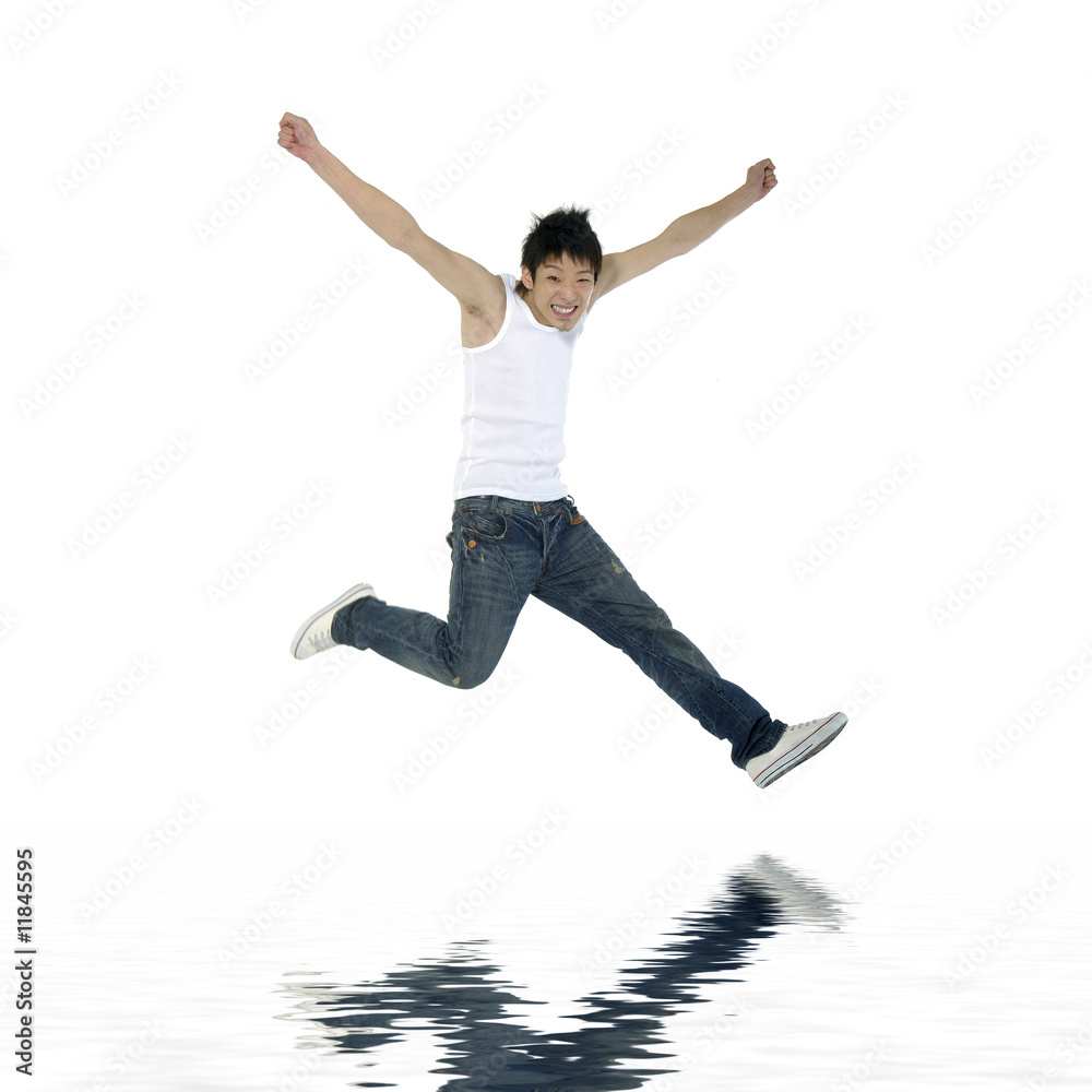 Young man flying in the air. with reflection