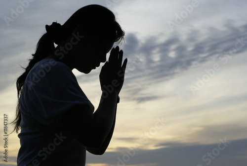 Woman praying silhouette