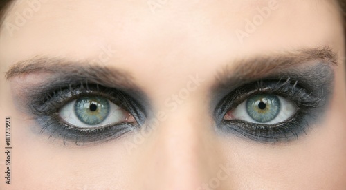 Green eyes woman, black makeup eye shadow