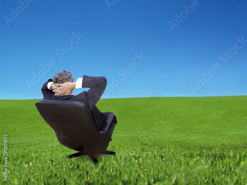 Daydreaming - businessman relaxing photo