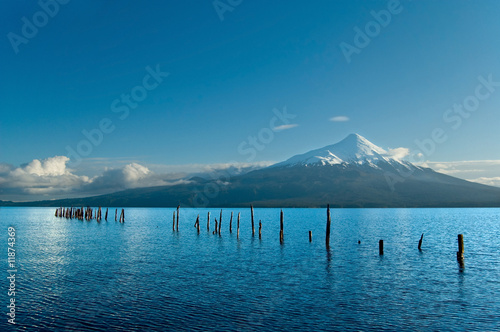 Snow peeked volcano, Chile, view from the lake photo