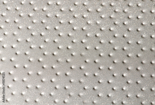 Polished metal surface with the small holes
