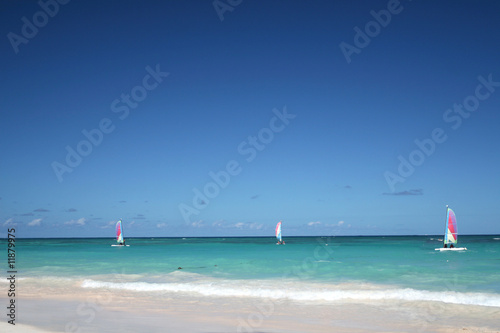 Sailboats in a tropical ocean © chasingmoments