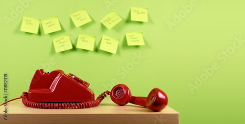 Red office telephone. Busy office concept.