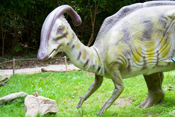 Poster Dinosaurus Dinosaurus in groen oerlandschap  © Zdenek Pistek