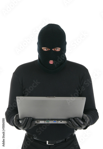 Computer criminal - Hacker with laptop computer