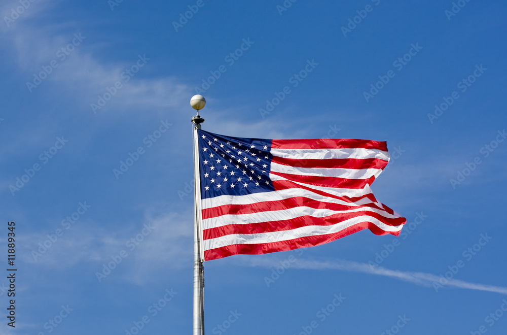 Obraz premium American Flag Blowing Blue Sky