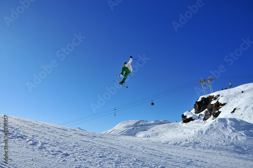 Aeroski: skier touching his ski during jump