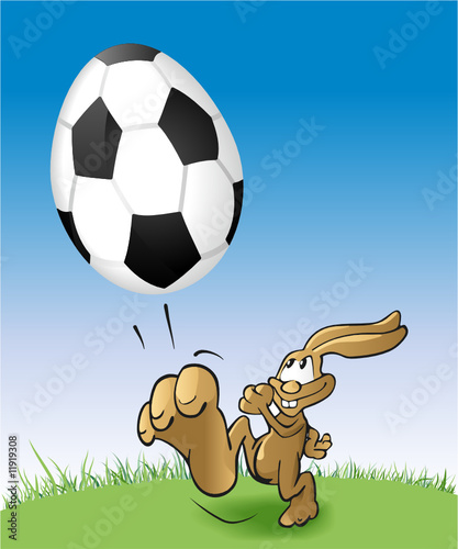 Osterhase kickt Fussball-Ei