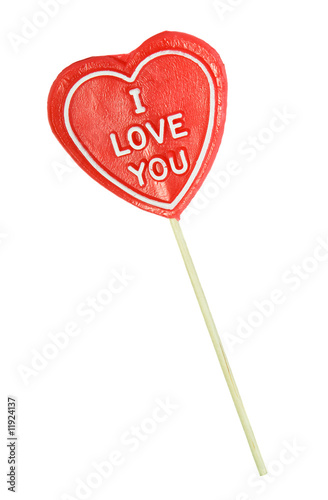 Heart shaped lollipop on white background