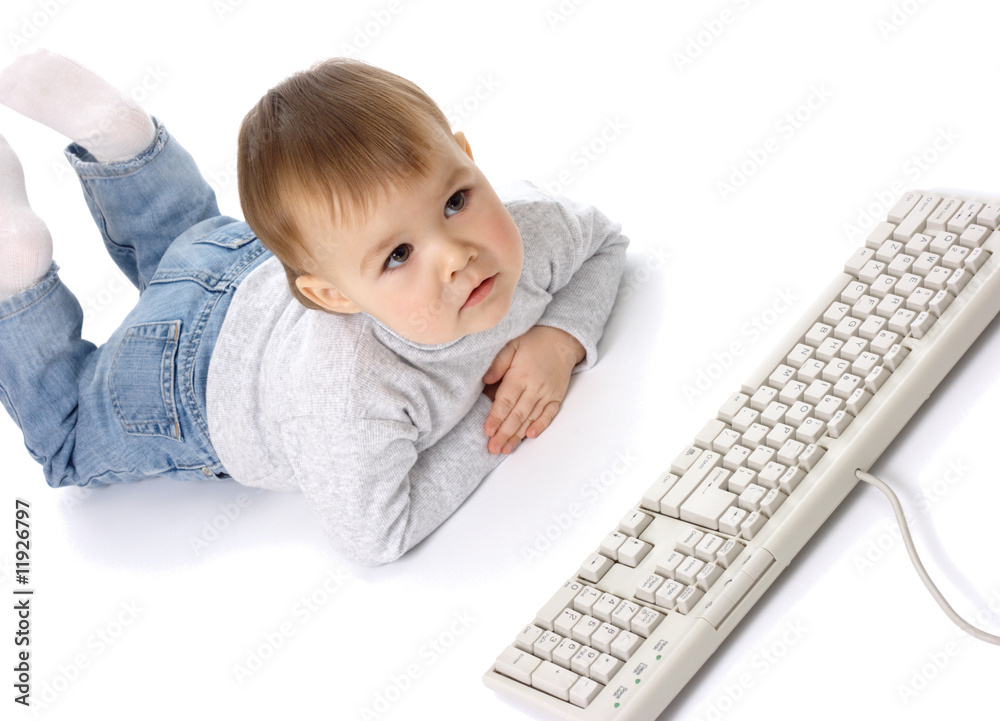 Cute child looking carefully at a monitor