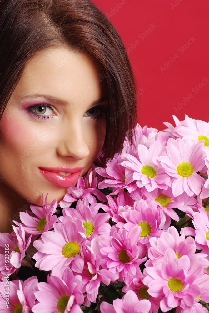 Attractive young woman face with flowers