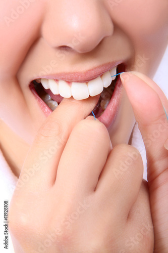 Woman Flossing Her Teeth