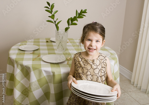 Girl setting table