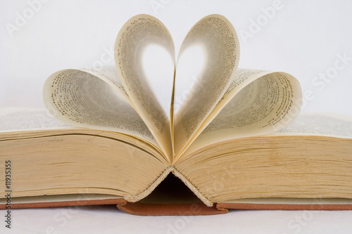 sheets of a book curved into heart shapes