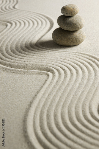 Stack of stones on raked sand #11954181
