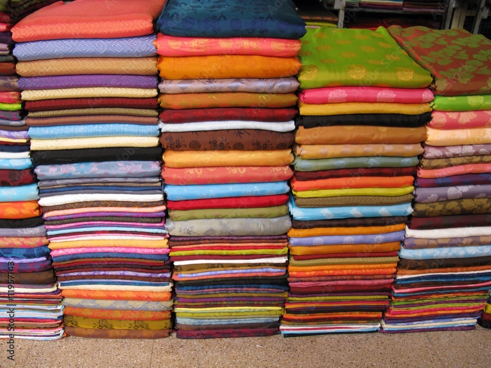 A stack of textiles at a shop A stack of textiles at a shop