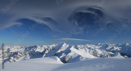 Winter mountains with magic clouds