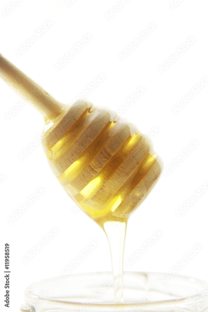 Wooden honey drizzler with a honey Wooden honey drizzler with a honey