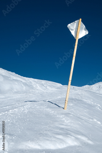 Metal sign at ski slope