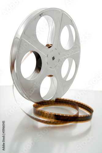 Vintage movie film and reel on white