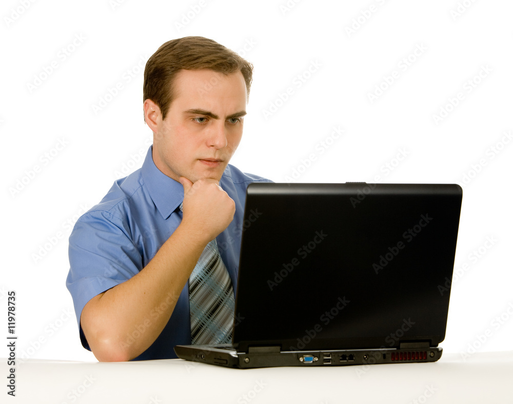 Young businessman working on a laptop. Isolated on white. Young businessman working on a laptop. Isolated on white.