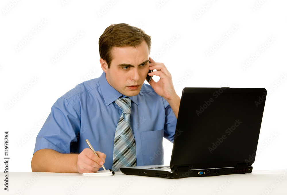 Young businessman working on a laptop. Isolated on white. Young businessman working on a laptop. Isolated on white.