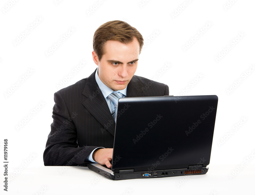 Young businessman working on a laptop. Isolated on white. Young businessman working on a laptop. Isolated on white.