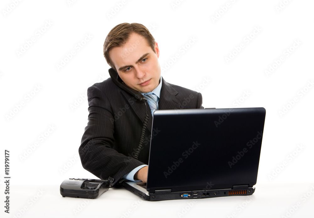 Young businessman working on a laptop. Isolated on white. Young businessman working on a laptop. Isolated on white.