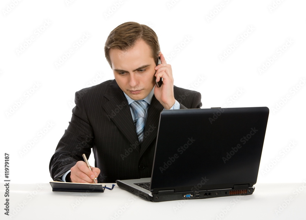 Young businessman working on a laptop. Isolated on white. Young businessman working on a laptop. Isolated on white.