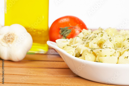 Pasta, parsley, garlics and oil bottle